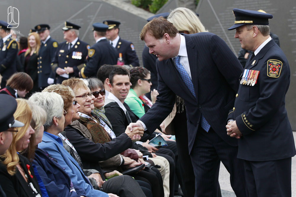Minister of Foreign Affairs John Baird greets families during the Canadian Fallen Firefighters memorial in Ottawa