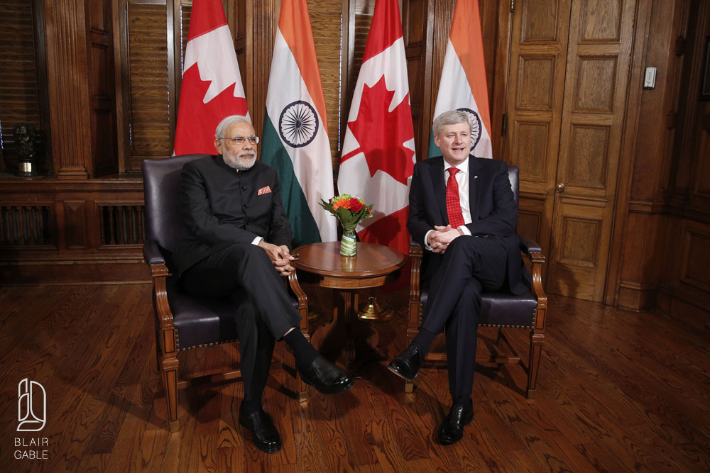 Canada's PM Harper sits with India's PM Modi on Parliament Hill in Ottawa