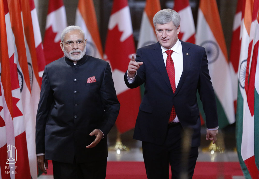 India's PM Modi and Canada's PM Harper walk to a news conference on Parliament Hill in Ottawa