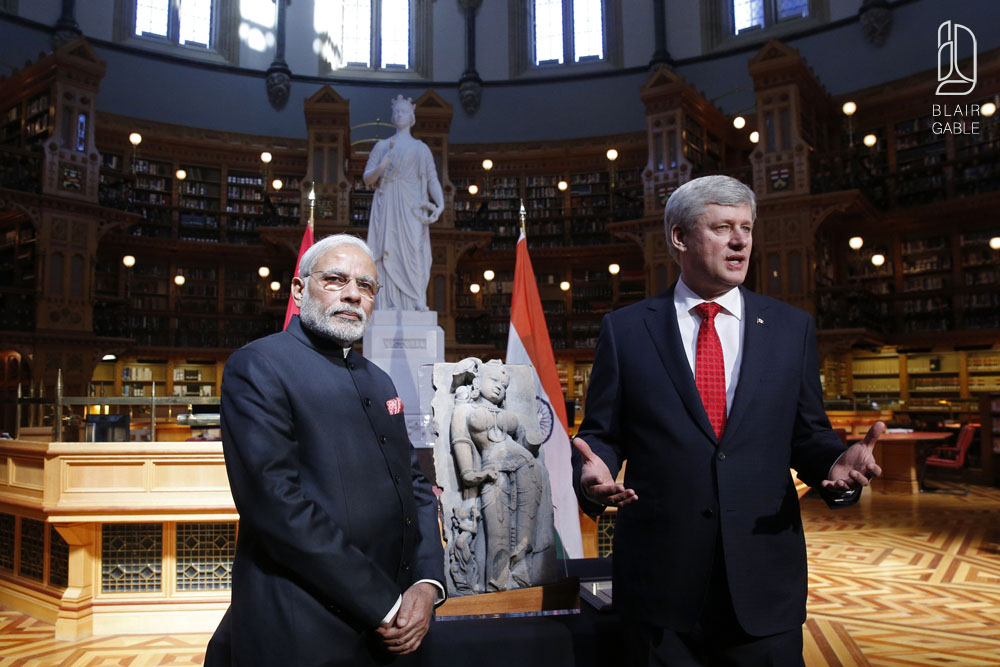 Canada's PM Harper presents India's PM Modi with a recovered Indian statue on Parliament Hill in Ottawa