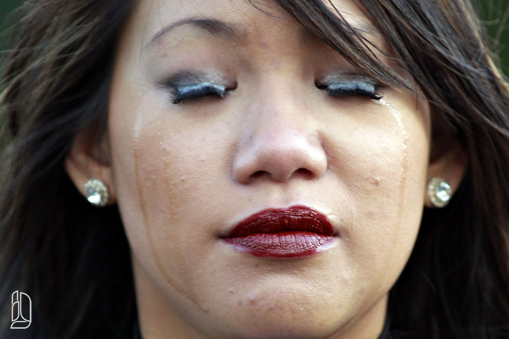 Cheerleader Holly cries during a ceremony at a Ottawa Sooners football game