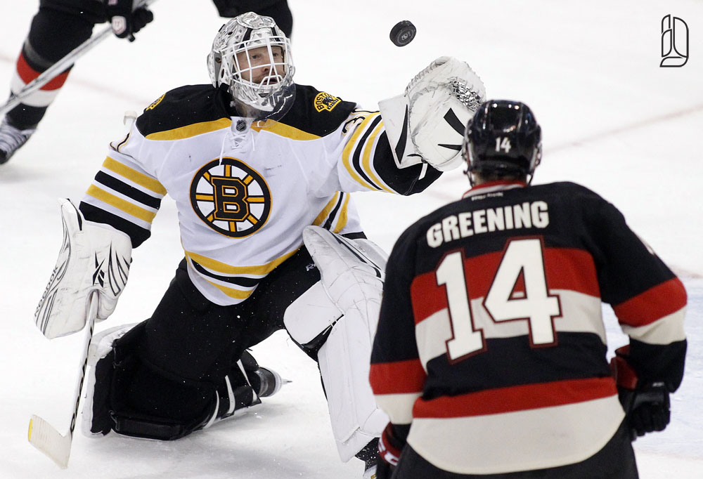 Bruins Thomas deflects the puck from Senators Greening in Ottawa