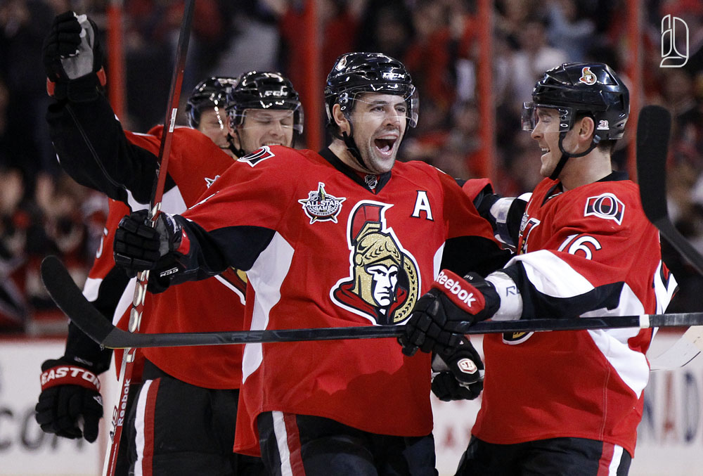 Ottawa Senators' Chris Phillips (C) celebrates his goal